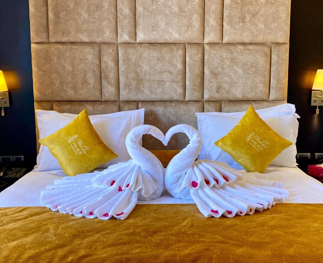 El Olivar Palace Marrakech El Harkat 외부 사진 Towel swans on a bed